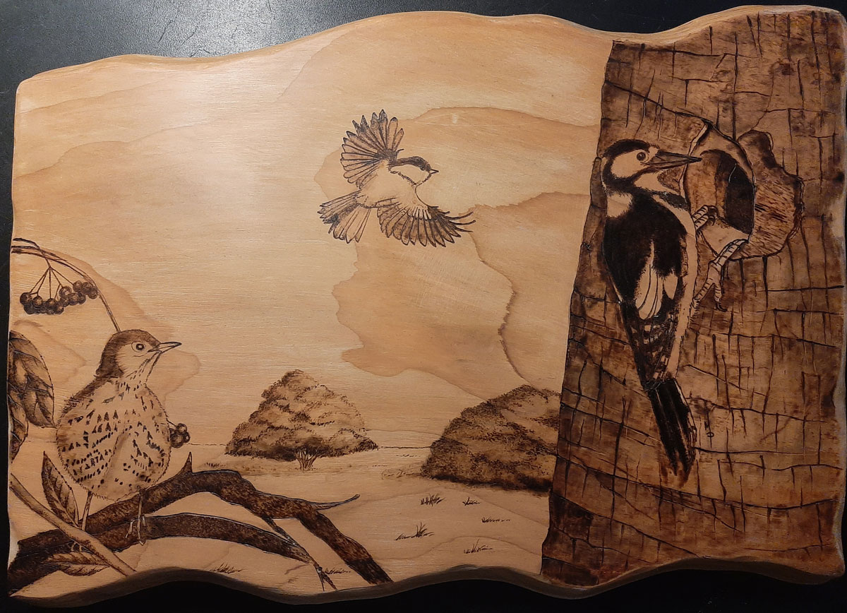 Pyrographed plaque for a naturalistic oasis. Pyrography on cedar wood.